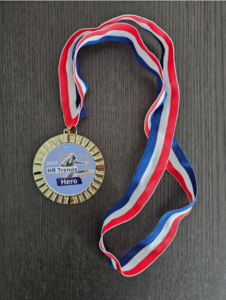 Employee appreciation medal at AIHR.